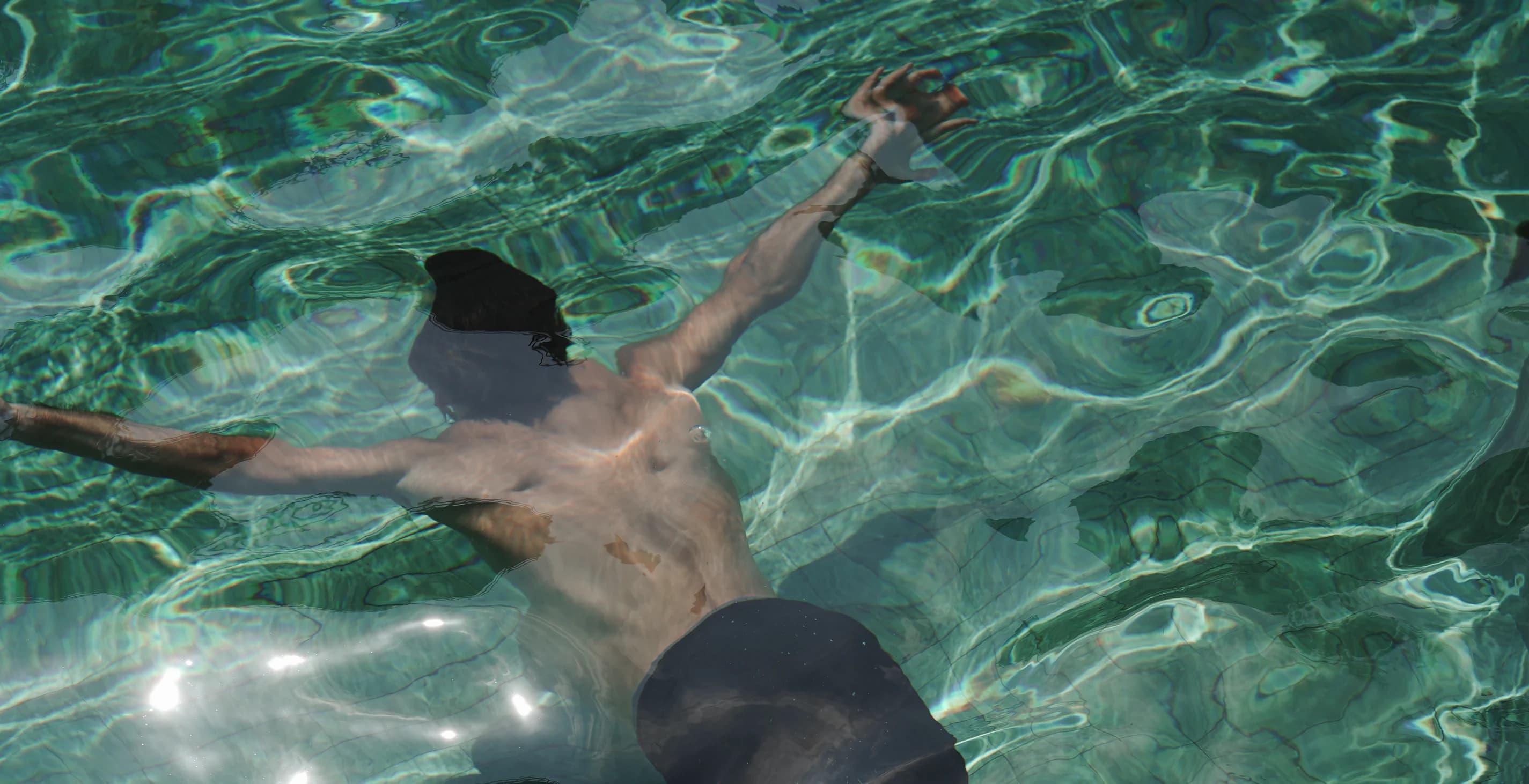 A guest swimming in the pool