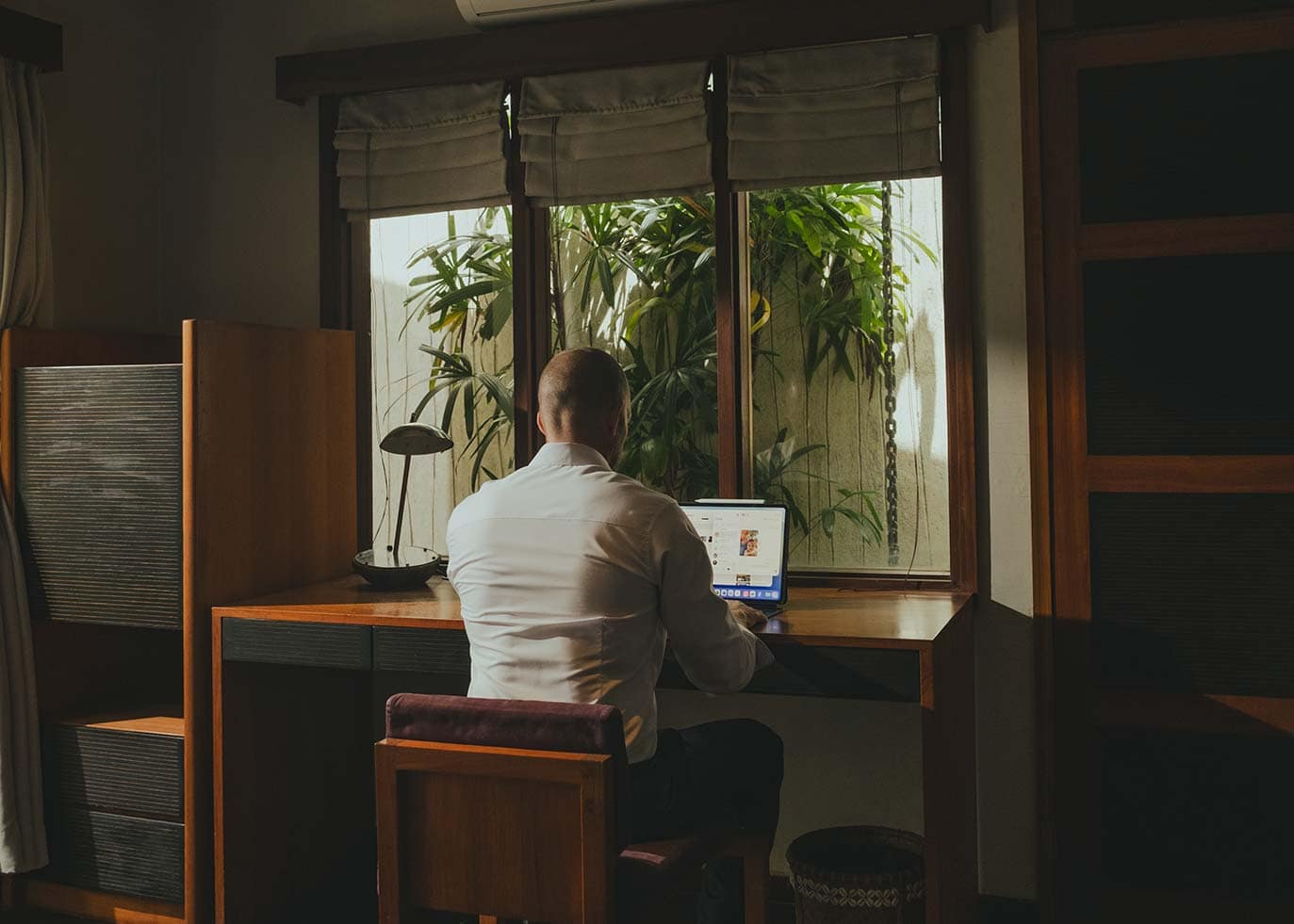 A guest working at a desk in a private office