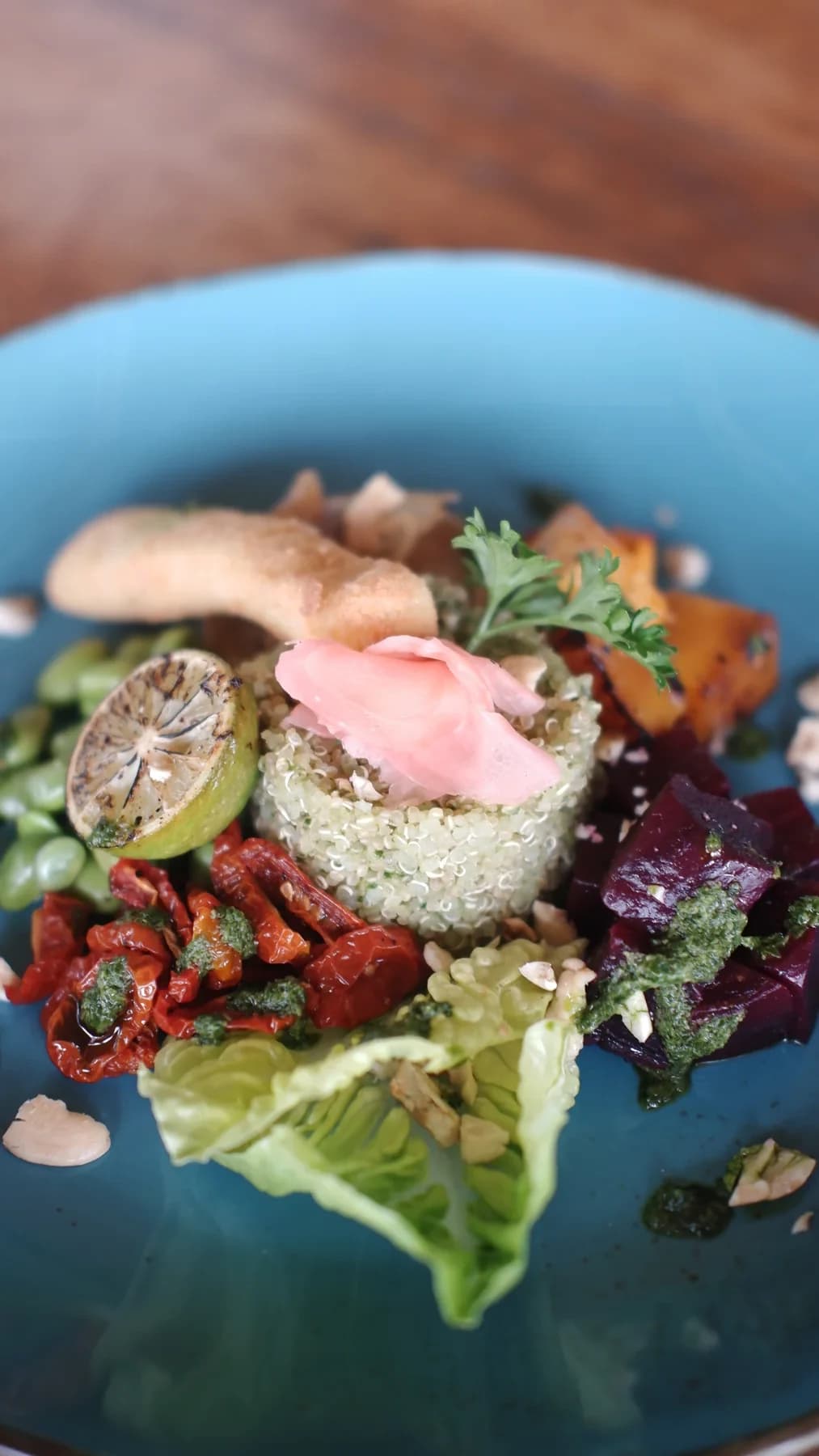 A plate of quinoa, beetroot, roasted tomatoes and salad