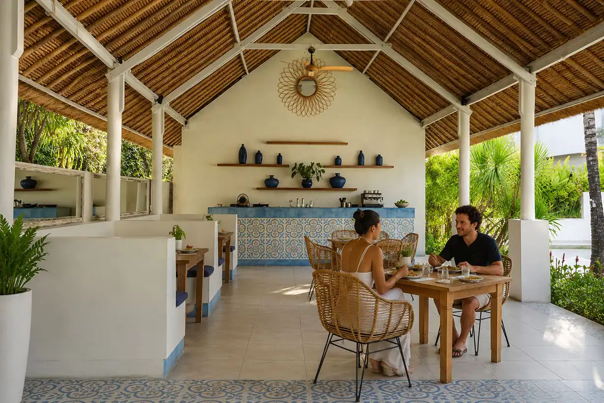 Two guests at a table in the dining pavilion