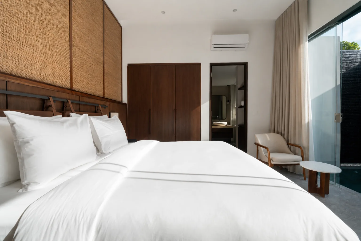 Second bedroom overlooking the private villa courtyard