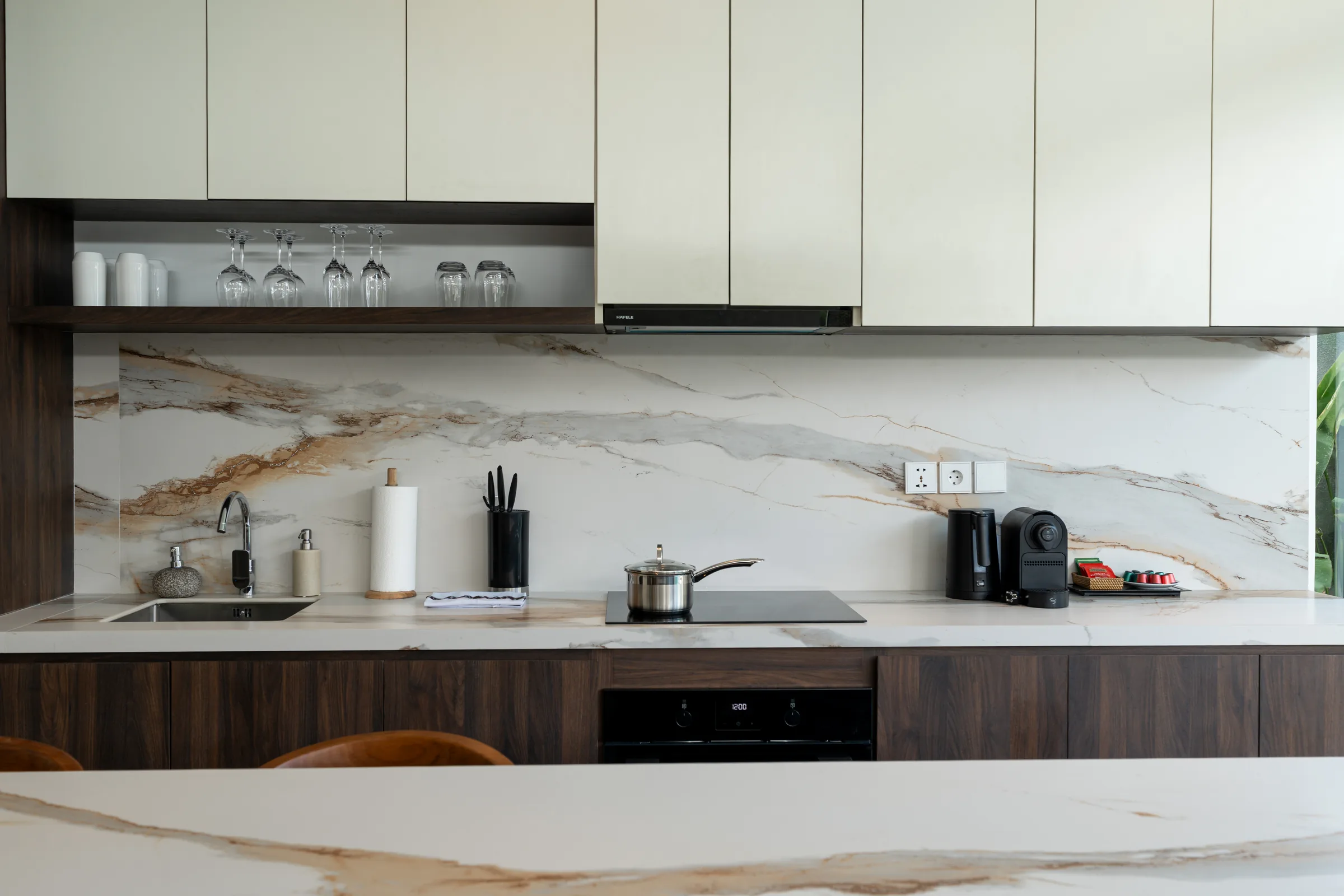Wood and marble finishes in the two-bedroom villa kitchen