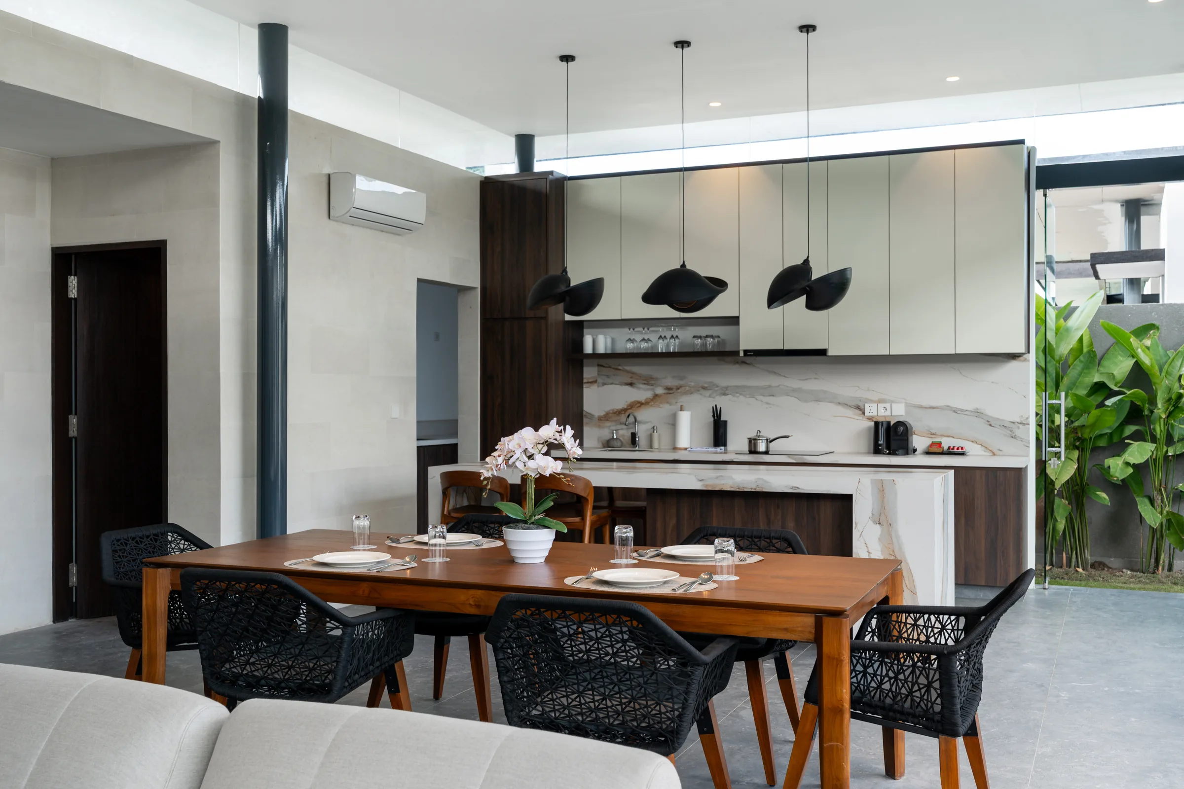 Dining table and kitchen viewed from the villa living space