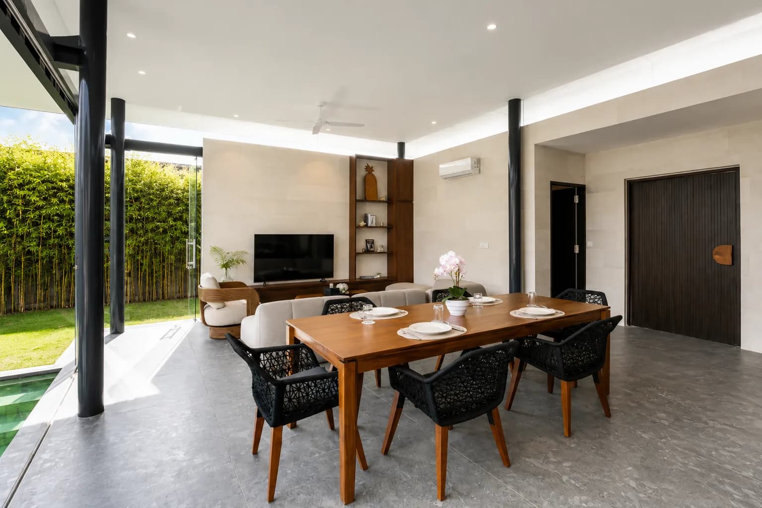 Bright dining and living space opening to the private pool