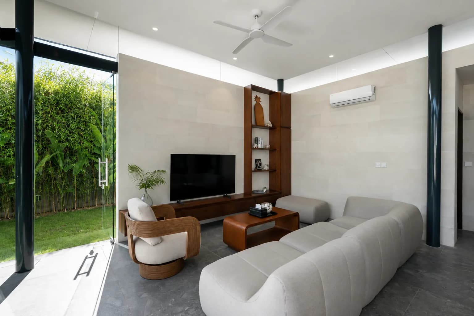 Modern living room overlooking the villa garden