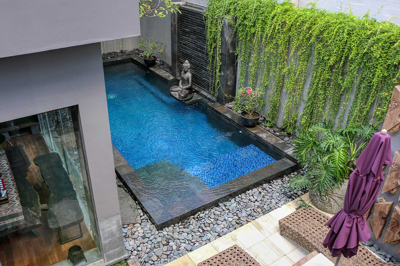 The pool and grounds at Pronoia Bali in Jimbaran