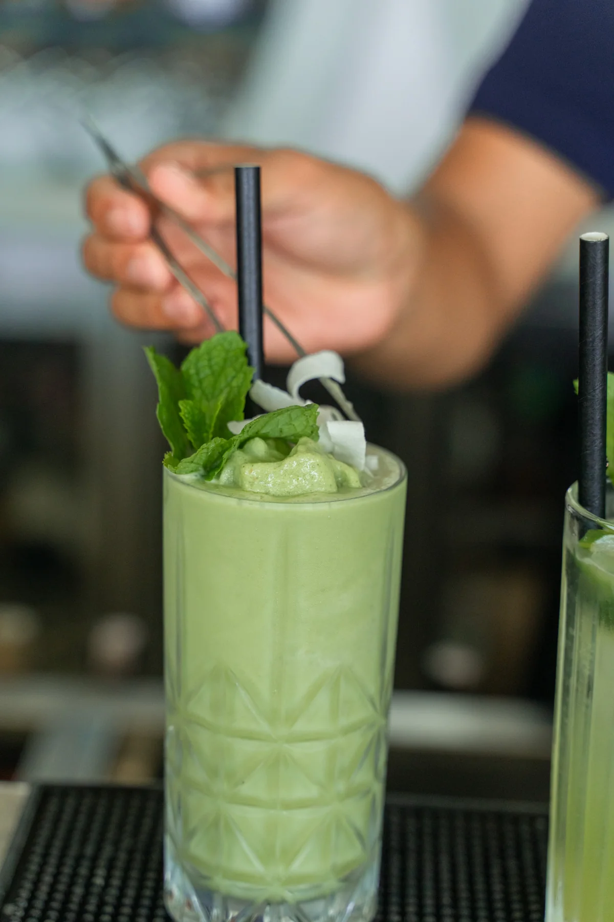 A drink being prepared at Azure Beach Restaurant by Pronoia