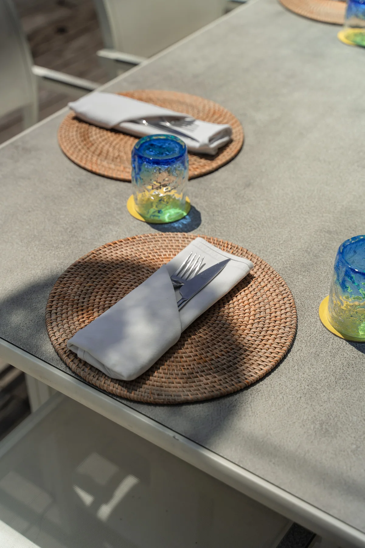 A table set for dinner at Azure Beach Restaurant by Pronoia